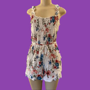 LILY Rose gauzy romper with smocked bodice and side pockets. Adorable for summer
